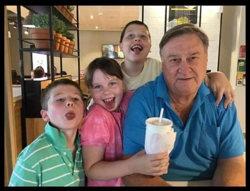 Megan's dad surrounded by his grandchildren. 