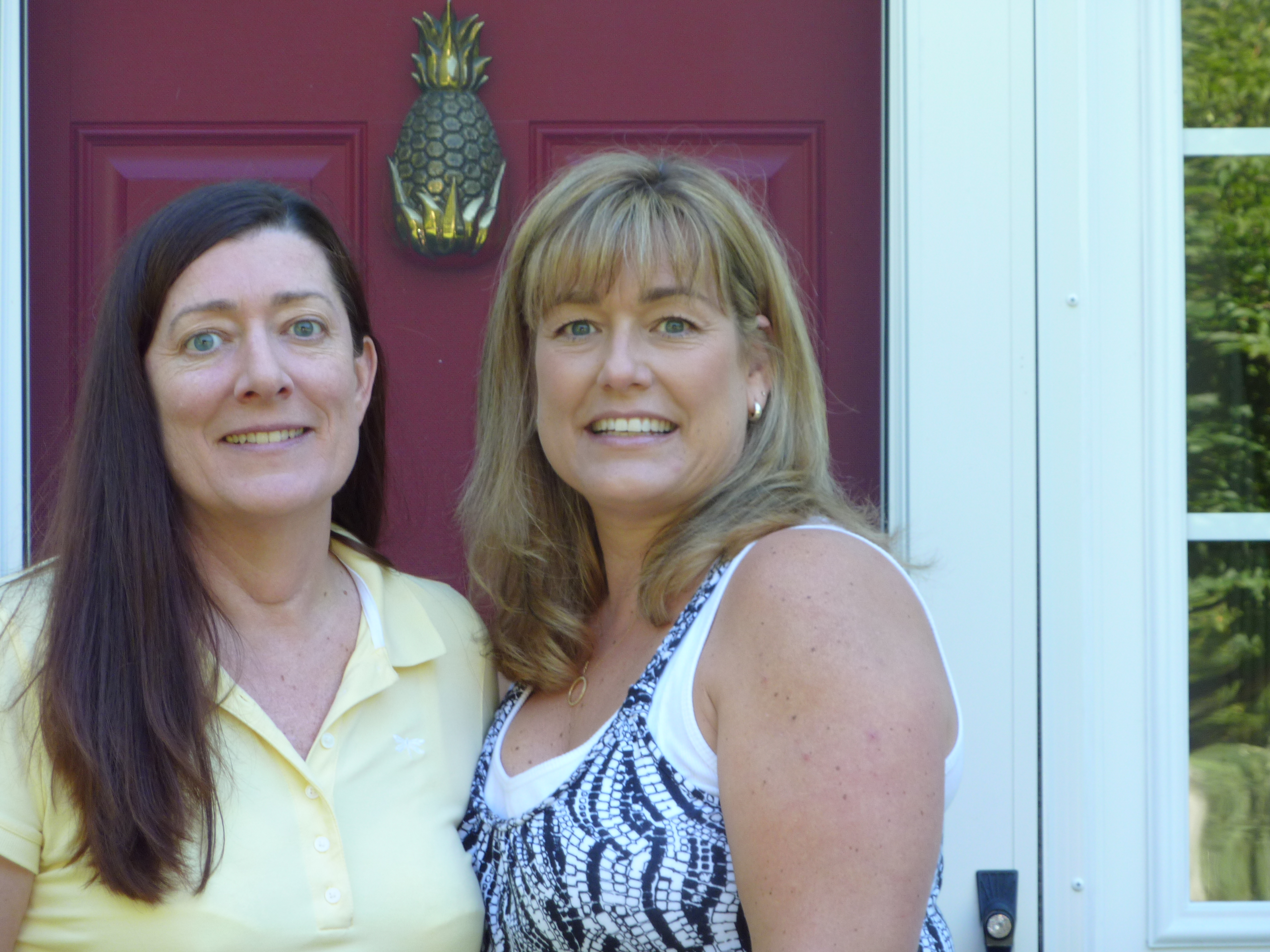 Kathy and Kelly standing next to one another smiling.