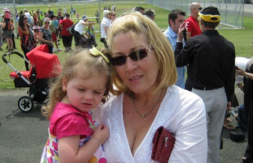 Maree holding her granddaughter. 