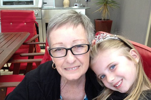 Lynn and her grand-daughter smiling at the camera. 