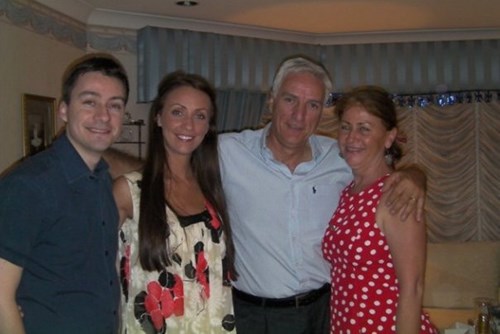 Jacqueline standing next to her brother, father and mother. 